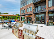 Thumbnail 42 of 48 - our apartments have a large outdoor patio with a grill and tables