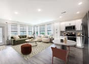 Thumbnail 26 of 34 - A modern kitchen with a dining table and chairs.