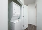 Thumbnail 46 of 61 - A white dishwasher and oven in a kitchen.