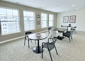 Thumbnail 17 of 34 - A conference room with a table and chairs.