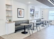 Thumbnail 5 of 34 - A modern living room with a grey sofa and a white sideboard.
