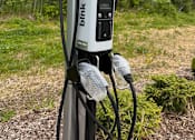 Thumbnail 22 of 61 - A Blink charging station is set up outdoors.