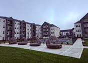 Thumbnail 20 of 61 - Apartment complex with tennis court and pavilions.