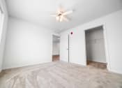Thumbnail 26 of 26 - a bedroom with white walls and carpet  at Union at Wiley, Cedar Rapids, Iowa