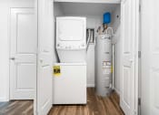 Thumbnail 21 of 26 - a small laundry room with a washer and dryer  at Union at Wiley, Cedar Rapids, 52404