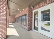 Thumbnail 6 of 26 - a brick building with a white door  at Union at Wiley, Iowa