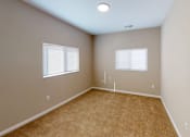 Thumbnail 8 of 18 - A room with a carpeted floor and two windows at Union at 16th, Indianapolis, IN 46222