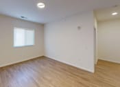 Thumbnail 5 of 18 - A room with a window and wooden flooring at Union at 16th, Indianapolis Indiana