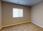 Thumbnail 6 of 18 - A room with a window and carpeted floor at Union at 16th, Indianapolis