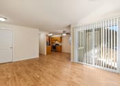 Thumbnail 8 of 66 - Cascade Woods living area with sliding glass door