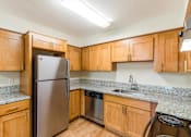 Thumbnail 40 of 66 - Cascade Woods kitchen area with fridge and dishwasher