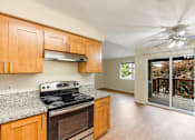 Thumbnail 42 of 66 - Cascade Woods stove and kitchen area