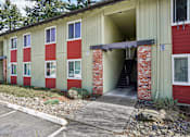 Thumbnail 3 of 44 - A red and beige building with a number 20 on the front.