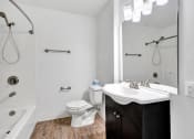Thumbnail 33 of 44 - a bathroom with a toilet sink and bathtub