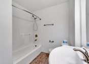 Thumbnail 34 of 44 - a bathroom with a tub and a sink