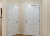 Thumbnail 53 of 66 - Two white doors in a room.