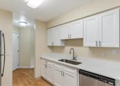 Thumbnail 54 of 66 - Cascade Woods kitchen area with sink and dishwasher