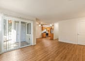 Thumbnail 21 of 66 - Cascade Woods living area with sliding glass door