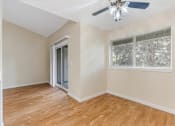 Thumbnail 57 of 66 - Cascade Woods dining area with sliding glass door and ceiling fan