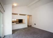 Thumbnail 36 of 40 - A room with a grey floor and white walls.