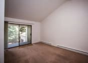 Thumbnail 31 of 40 - A room with brown carpet and white walls.