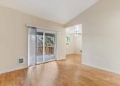Thumbnail 58 of 66 - Cascade Woods living area with sliding glass door