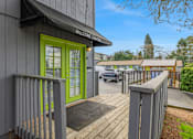 Thumbnail 9 of 31 - A building with a green door and a sign that says "Welcome Center".