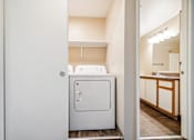 Thumbnail 31 of 35 - A white fridge in a small kitchen.