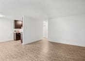 Thumbnail 16 of 44 - A room with a brown cabinet and a white wall.