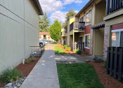 Thumbnail 40 of 44 - a view of a sidewalk in front of some buildings