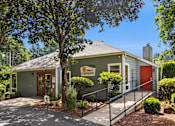 Thumbnail 2 of 40 - A building with a red door and a sign that says "Mount of Creekside".