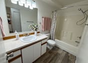 Thumbnail 22 of 56 - A bathroom with a sink, toilet, and shower.