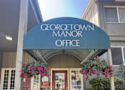 Thumbnail 1 of 38 - The entrance to the Georgetown Manor Office is adorned with flowers.