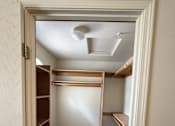 Thumbnail 13 of 18 - A small room with a closet and a skylight.