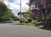 Thumbnail 15 of 17 - Parking lot at Ashley Court Apartments Portland, Oregon