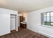 Thumbnail 38 of 40 - A room with a brown carpet and a white wall.