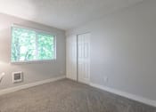Thumbnail 51 of 64 - A room with a window and a door.