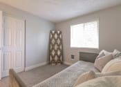 Thumbnail 53 of 64 - A bedroom with a bed, pillows, and a window.