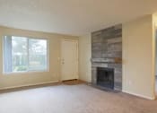 Thumbnail 64 of 64 - A room with a fireplace and a door.
