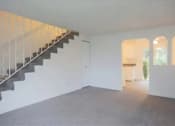 Thumbnail 61 of 64 - A room with a staircase and a window.