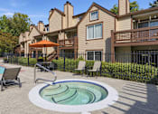 Thumbnail 1 of 56 - A pool with a hot tub in front of a house.