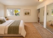 Thumbnail 5 of 56 - A bedroom with a large bed and a carpeted floor.