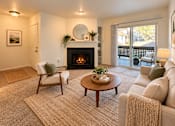 Thumbnail 4 of 56 - A cozy living room with a fireplace and comfortable seating.