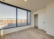 Thumbnail 52 of 81 - A room with a large window and a sliding door.