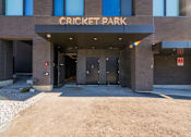 Thumbnail 38 of 81 - The front of a building with the words "Cricket Park" on it.