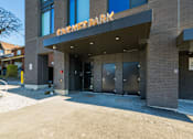 Thumbnail 37 of 81 - The Cricket Park building is made of brick and has a large entrance.
