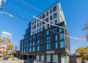 Thumbnail 36 of 81 - A modern building with a glass facade is located on Elgin Street.