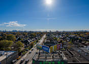 Thumbnail 34 of 81 - A sunny day in a city with a clear blue sky.
