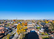 Thumbnail 33 of 81 - A view of a residential area with houses and trees.
