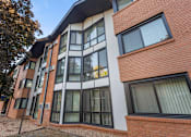 Thumbnail 7 of 58 - A modern building with a combination of brick and white walls.